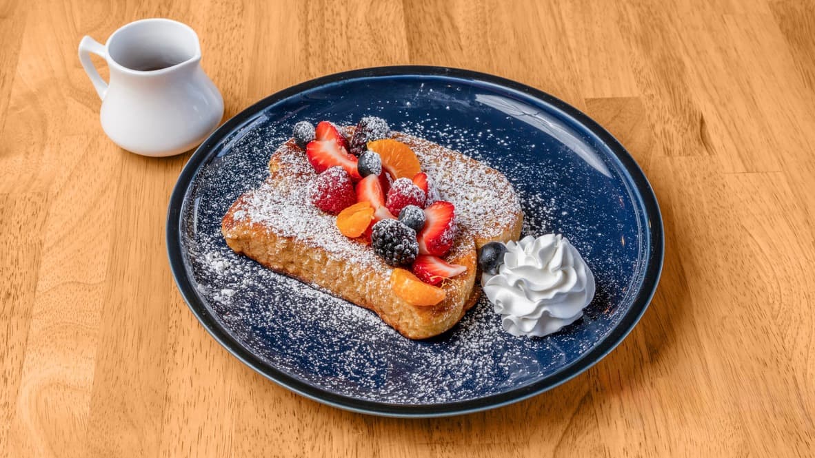 Floré French toast with mixed berries, whipped cream and maple syrup