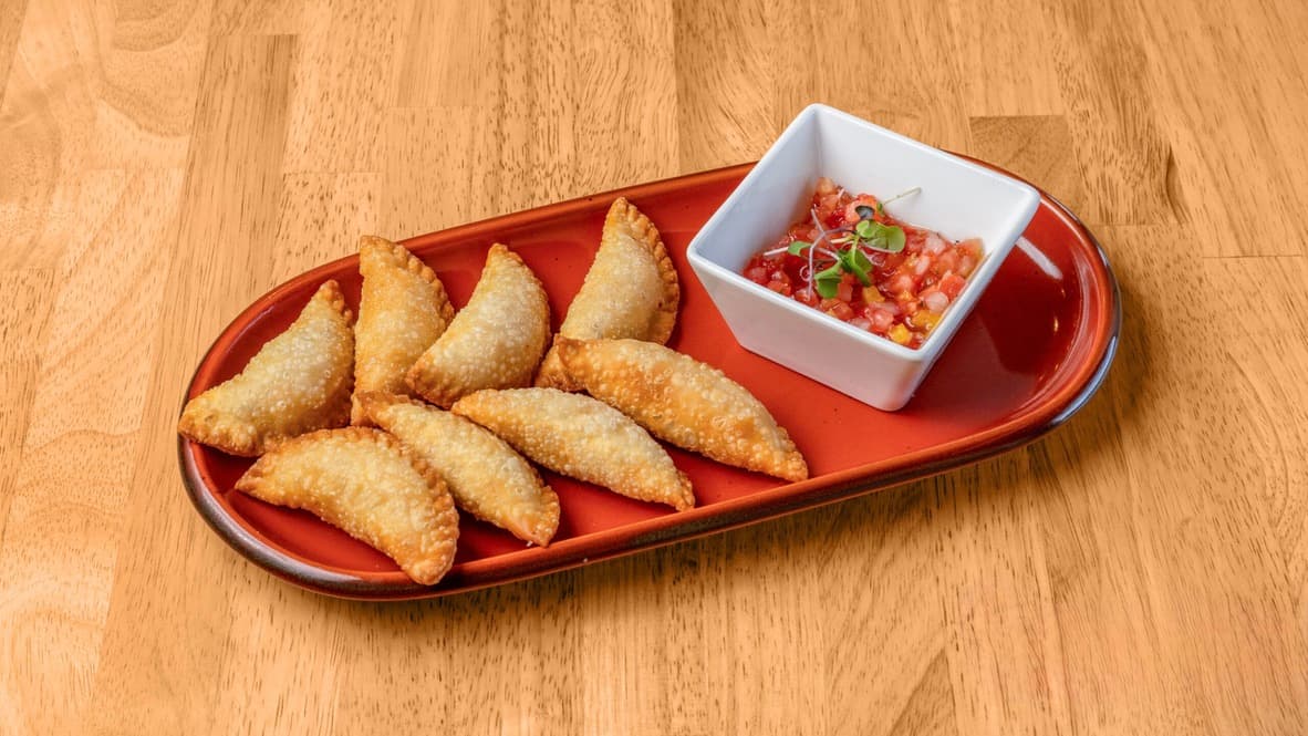 Floré mini pasteis served with fresh vinaigrette