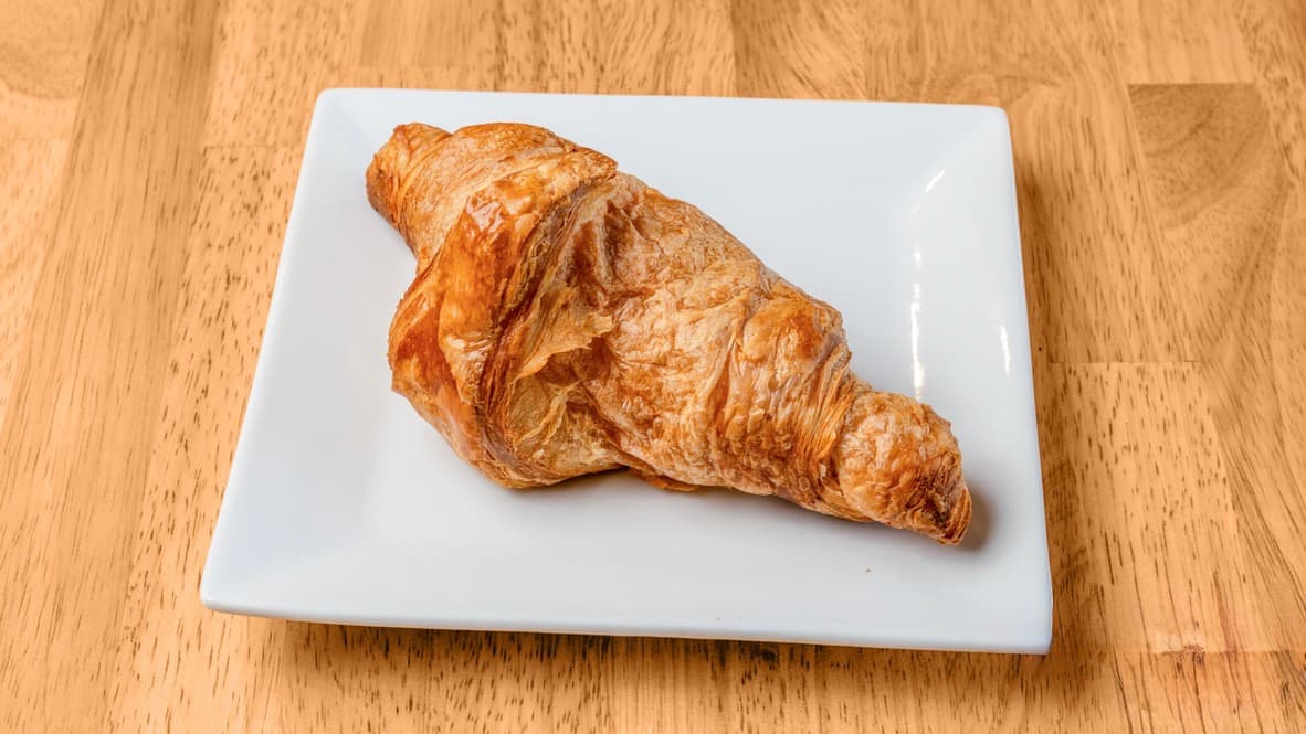 Freshly baked plain croissant from Floré Café & Kitchen